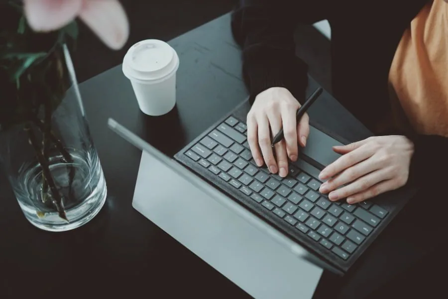 Person working on a laptop used for Tableau Web Data Connector development